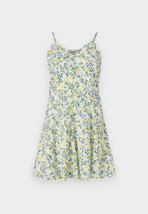 Kohmakas kleit, millel on kollaste ja roheliste lehtede muster valgel taustal. Omab peeneid rihmu, V-kaela ning laienevat seelikut. Kerge kangas.