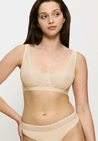 Triumph AURA SPOTLIGHT  beżowy