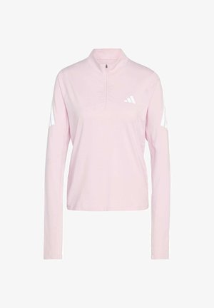 Svijetloružičasta sportska majica dugih rukava s patentnim zatvaračem do četvrtine, s bijelim detaljima i tri pruge na svakoj rukavu. Glatka, lagana tkanina.