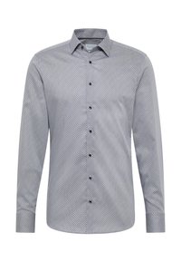 Langärmliges Hemd mit Knopfleiste aus gewebtem Stoff, das ein geometrisches Muster in Marineblau und Weiß zeigt, mit einem spitzen Kragen und schwarzen Knöpfen.