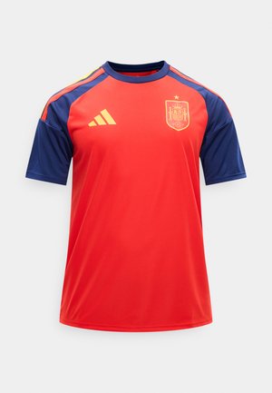 Rød og marineblå spansk fodboldtrøje med gul Adidas-logo og nationalt holdemblem på brystet, korte ærmer og rund hals.