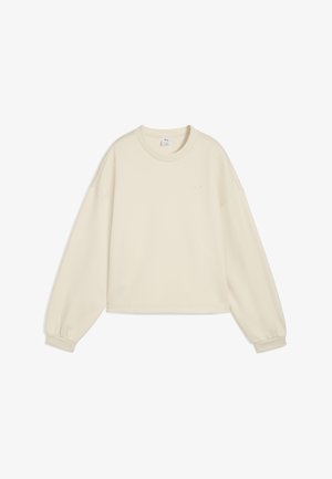 Kremowy długi rękaw bluzę z luźnym krojem, okrągłym dekoltem, marszczonymi rękawami oraz małym logo na piersi. Gładka tekstura.