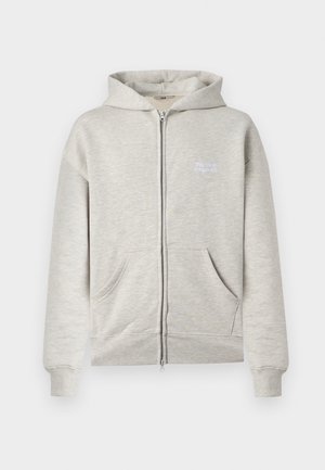 Helehall valgikapuutsiga traksiga dressipluus esitaskute, soonikkoes mansettide ja äärega ning vasakul rinnal valge tekstiga "the new originals".