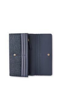 Navy wallet featuring a textured exterior with small dots, a smooth interior, multiple card slots, and a gold snap closure.