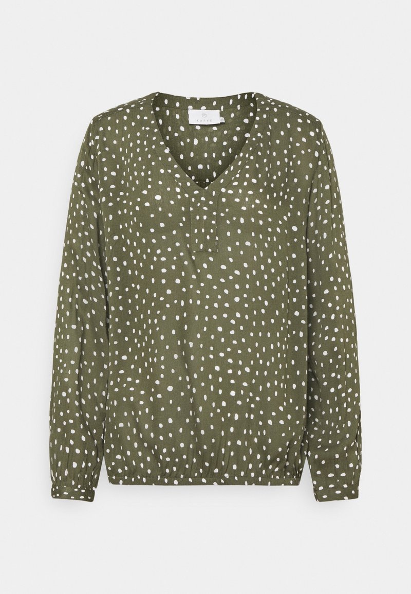 Blouse vert olive à manches longues avec des points blancs irréguliers, col en V, et ourlet et poignets élastiqués.