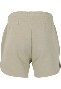 Beiga bomullsshorts med elastisk midja, med en lös passform och inga synliga fickor. Tyget har en slät yta.