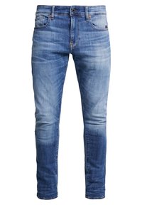 Jean denim bleu slim fit pour homme avec fermeture par bouton et zip, cinq poches et détails délavés sur les cuisses et les genoux.