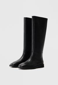 Knee-high black leather boots with a smooth texture, rounded toe, and a flat sole. Features a sleek, minimalistic design without embellishments.