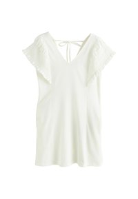 Haut blanc à manches courtes avec un décolleté en V et un détail à nouer dans le dos. Présente des manches volantées et une texture de tissu douce.