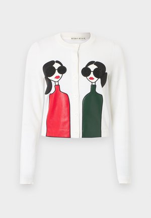 White cardigan featuring two illustrated figures with sunglasses. One wears a red top, the other a green top; both have black hair and lips.