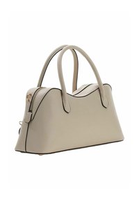 Sac à main beige avec une surface texturée, forme arrondie et bordure noire contrastante. Comprend deux poignées et une fermeture éclair.