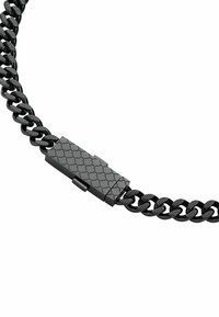 Collana a catena in metallo nero con maglie incastrate e chiusura testurizzata con motivo geometrico. Finitura liscia su tutta la lunghezza.