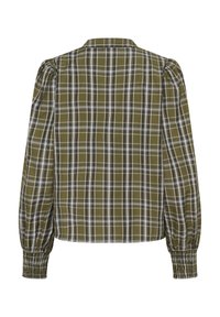 Blouse à carreaux verts avec manches ballon, col et poignets smockés. Le tissu présente un motif texturé avec des lignes blanches et noires.