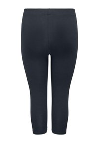 Schwarze Dreiviertel-Leggings aus elastischem Stoff, mit glatter Oberfläche und ohne sichtbare Nähte oder Muster.