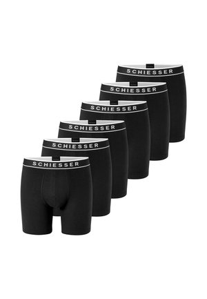 Seis bóxers negros para hombre Schiesser con cinturillas elásticas blancas que llevan el logo de Schiesser, dispuestos en línea diagonal.