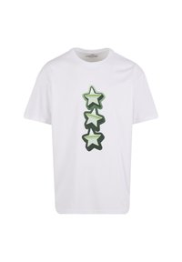 White cotton t-shirt featuring three stacked green and light green star graphics in a playful design. Short sleeves and crew neck.
