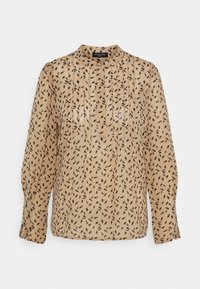 Blusa beige trasparente con un collo alto, maniche lunghe e un motivo nero a forma di foglia in tutta la superficie. Presenta pieghe verticali per aggiungere texture.