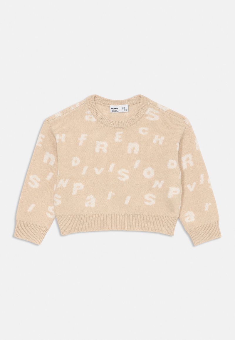 Bežist õmmeldud kampsun, millel on valged tähed, mis ütlevad "French Division Paris" pehmes tekstuuris. Ümmargune kaelus ning soonikkoes ääred ja varrukad.