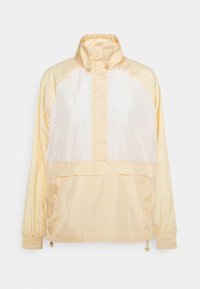 Giacca pullover gialla chiara con colletto alto, apertura frontale a metà zip, finitura in satin, polsini elastici e due tasche laterali.