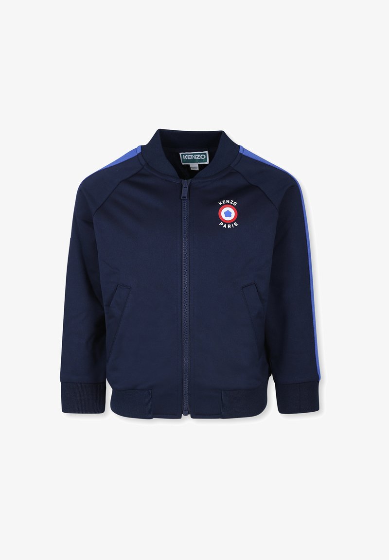 Veste zippée marine en tissu lisse, dotée d'un emblème rond avec le texte "KENZO PARIS", des poignets côtelés et des rayures bleues sur les épaules.