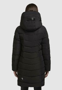 Black puffer coat with a hood, featuring a quilted pattern, long sleeves, and a logo accent on the back. The fabric appears smooth and textured.