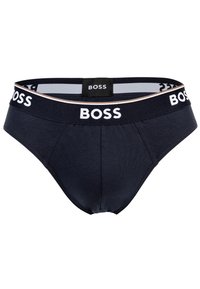 Slip da uomo blu navy realizzati in tessuto morbido, con un logo "BOSS" bianco sulla vita, caratterizzati da una vestibilità aderente e una texture liscia.