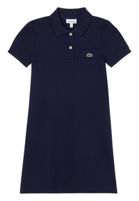 Kleid aus navyblauem Baumwollpolo. Hat einen Knopfverschluss mit drei Knöpfen, kurze Ärmel und eine Tasche mit einem grünen gestickten Logo.