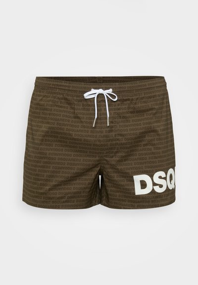 Brown swim shorts with all-over DSQUARED2 text pattern, white drawstring, and large white "DSQ" print on the left leg.