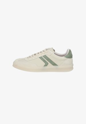 White sneakers with green suede accents, featuring a smooth leather upper, rounded toe, and a textured sole. Laces are cream-colored.
