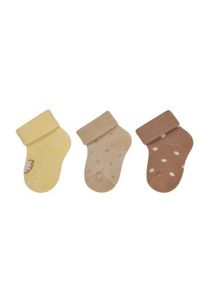 Drei Paar gerippte Socken: blassgelb, beige mit Polka-Dots und braun mit weißen Punkten. Jedes Paar hat eine umgeschlagene Bündchen und eine weiche Textur.