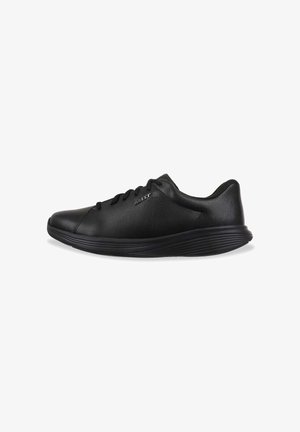 Black athletic shoe with a smooth leather upper, curved sole, and flat lace closure; features subtle branding on the side.