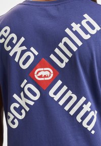 Blue cotton T-shirt featuring a bold white and red graphic print, with the brand name "eckó unltd." displayed in a diagonal pattern.