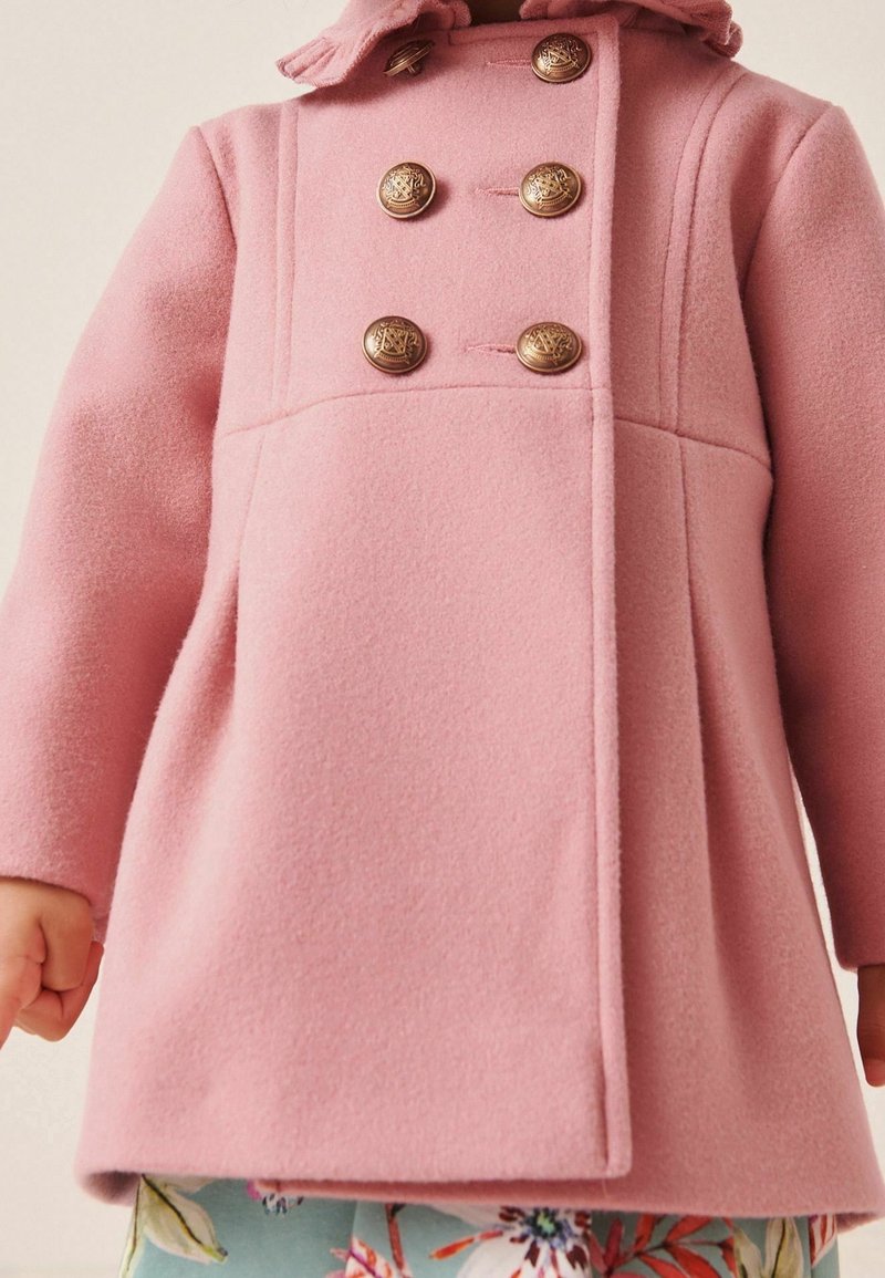 Pink wool blend coat featuring a double-breasted design, five gold buttons, and a ruffled hood. Textured finish with side pockets.