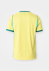 Maglia sportiva gialla a maniche corte con pannelli laterali turchesi e bordatura turchese su colletto e polsini, vista da dietro su sfondo bianco.