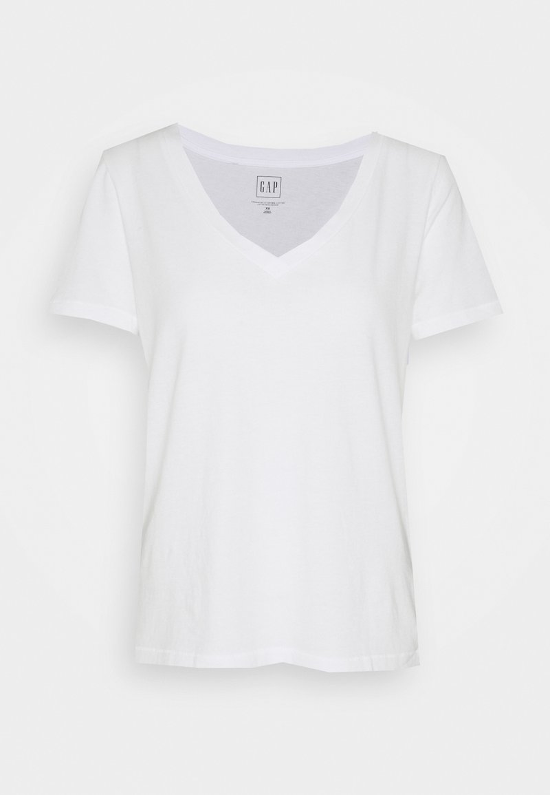 Biały t-shirt z dekoltem w serek, wykonany z bawełny, krótki rękaw, luźny krój, z prostym dołem i metką przy dekolcie. Gładka faktura, minimalistyczny design.