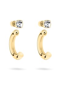 Boucles d'oreilles en ton or avec une forme courbée, présentant un accent rond près du haut et un cristal carré transparent à la base. Texture lisse.