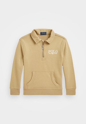 Suéter beige con un cuello de media cremallera, bolsillo frontal tipo pouch y logo bordado "POLO". Fabricado con un tejido suave y liso, con puños acanalados.
