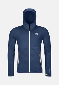 Navy blue jacket with a zippered front and hood. Features grey side panels, purple accents, and a logo on the chest. Made of soft, stretchy material.