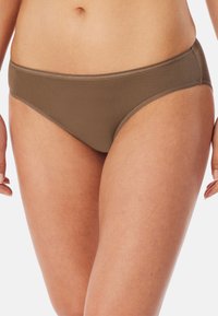 Brown bikini briefs made of smooth fabric, featuring a low-rise cut and minimal stitching details along the waistband and leg openings.