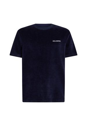 Mörkblå sammetsliknande t-shirt med kort ärm som har rundad halsringning och en vit "Karl Lagerfeld" logga på bröstet. Mjuk textur och avslappnad passform.
