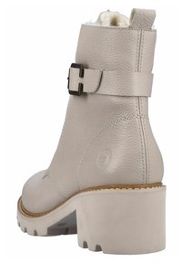 Botte de cheville en cuir gris clair avec une finition texturée, un bout rond, une sangle à boucle et un talon épais. Comprend une doublure intérieure douce.