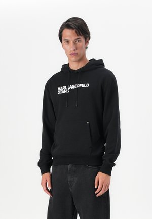 Schwarzer Hoodie mit Kängurutasche, versehen mit dem weißen Text "KARL LAGERFELD JEANS". Aus Baumwolle, mit lockerer Passform und verstellbarem Kapuzenzug.