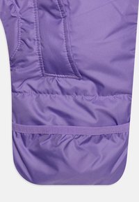 Purple insulated fabric, featuring a smooth texture, stitched seams, and a pocket. The hem is gathered with an elastic band for fit.