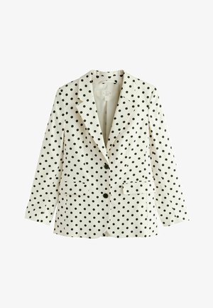 Sacou alb croitorit cu buline negre, rever cu tăietură în V, două buzunare frontale cu clapetă și două nasturi negri în față.