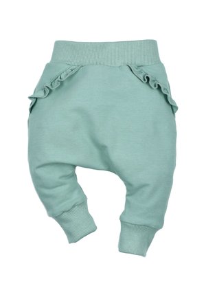 Helle mintgrüne Kinderhosen aus weicher Baumwolle, mit Rüschentaschen, gerippten Knöchelbündchen und einem gerippten Taillenbund.