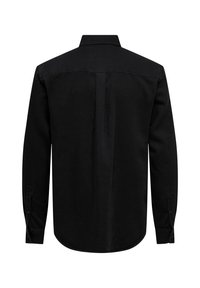 Chemise noire à manches longues boutonnée, vue de dos, avec un pli central, col classique et poignets boutonnés.