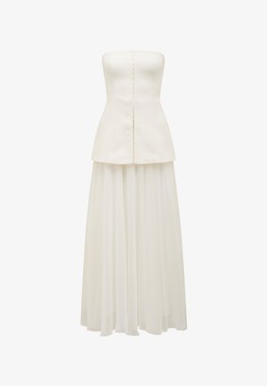 Trägerloses weißes Kleid mit einem figurbetonten Oberteil, einem Peplum-Taille und einem fließenden, durchsichtigen Rock. Rückenverschluss mit sichtbaren Knöpfen.