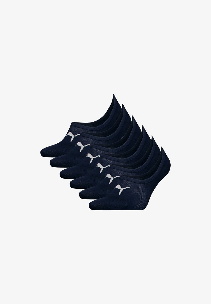 Acht paren donkerblauwe low-cut Puma-sokken gerangschikt in twee rijen, elk met een wit Puma-logo nabij de tenen.