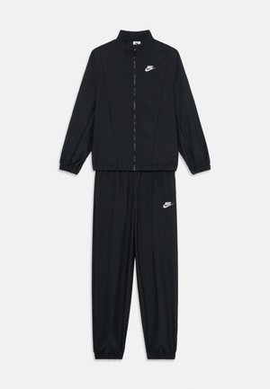 Survêtement noir comprenant une veste zippée avec col montant et poignets élastiques, associée à un pantalon assorti avec taille élastique et poignets.