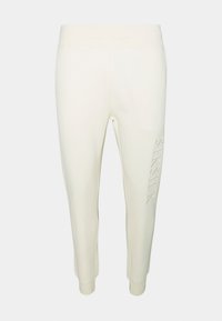 Ljusgrå joggers med en mjuk textur, som har ett figursytt midjeband och smalnande ben. Subtil präglad logotyp på vänster ben.